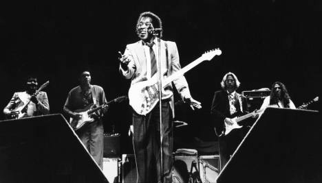 Buddy during Clapton's Royal Albert Hall Concerts.  In the back (from left to right) are: Albert Collins, Robert Cray, Eric Clapton and Joey Spampinato. 