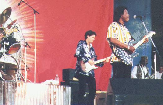 Buddy on stage during one of the many blues festivals in the summer of 1995. In the back Scott Holt.